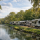 Long-term RVs parked along the river at Pecan Park Riverside RV Park during a mild Texas winter